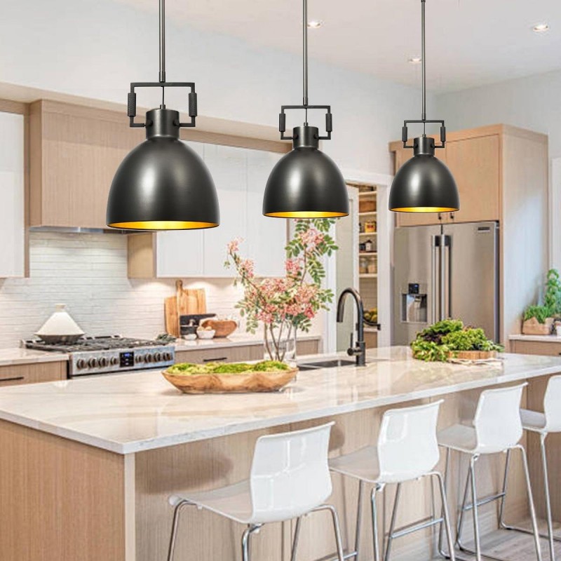 Modern pendant light fixture hanging above dining table