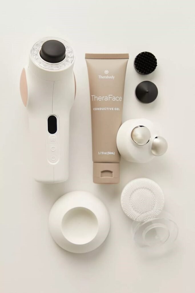 Therabody TheraFace PRO handheld facial skincare device with multiple attachments